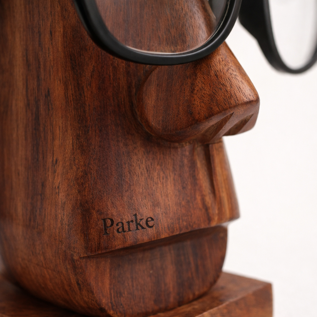 Side view of glasses resting on Parke with the lenses raised above the table