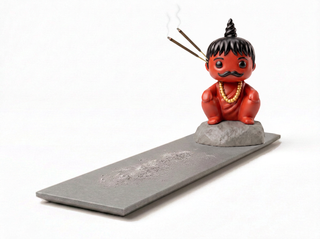 The earlier Pandit Ji figure with its long ash tray, now discontinued