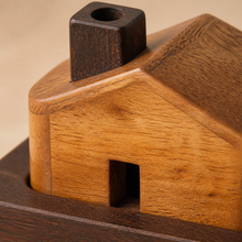 Close-up of the Kutir chimney, roof pitch and wood grain